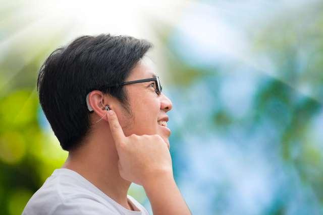 Young man with hearing aids