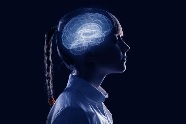 Side view of girl with brain illustration