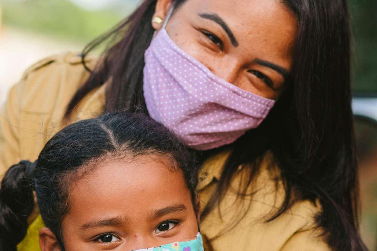 Mother and daughter with face masks